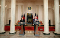 President George W. Bush responds to a reporter’s question during a joint news conference with German Chancellor Angela Merkel at the White House, Thursday, Jan. 4, 2006, answering questions on Iraq, the Middle East and U.S.-European economic issues. White House photo by Paul Morse.