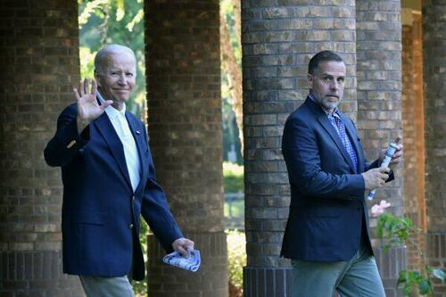 U.S. President Joe Biden (L) waves alongside his son Hunter Biden after attending mass at Holy Spirit Catholic Church in Johns Island, South Carolina on Aug. 13, 2022.