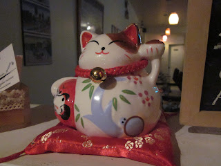 the beckoning cat is the first mark of a real Japanese restaurant, according to my wife