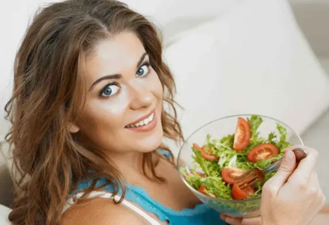 A woman eating a healthy diet for prevent hair fall
