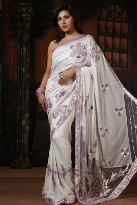 white cutwork saree with emboidery work and sequin