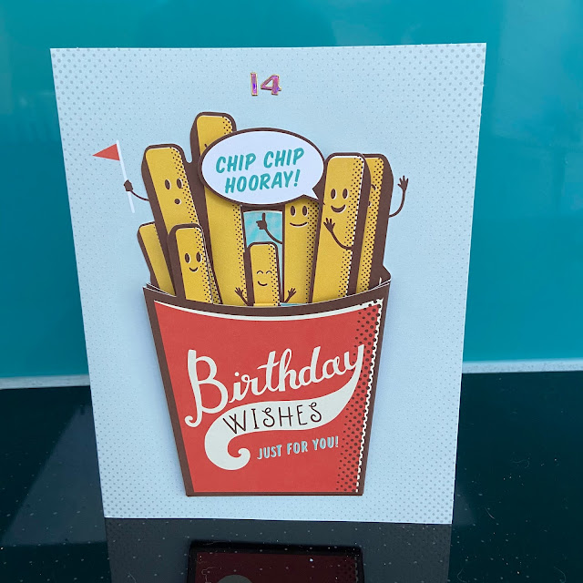 birthday card with fries with faces on the front, with speech bubble saying chip chip hooray, sitting in a packet with words Birthday Wishes just for you printed on it