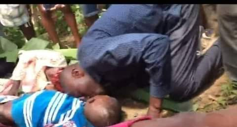 Heartbreaking photo of father planting a kiss on his 11-year-old dead son killed in Cameroon school shooting