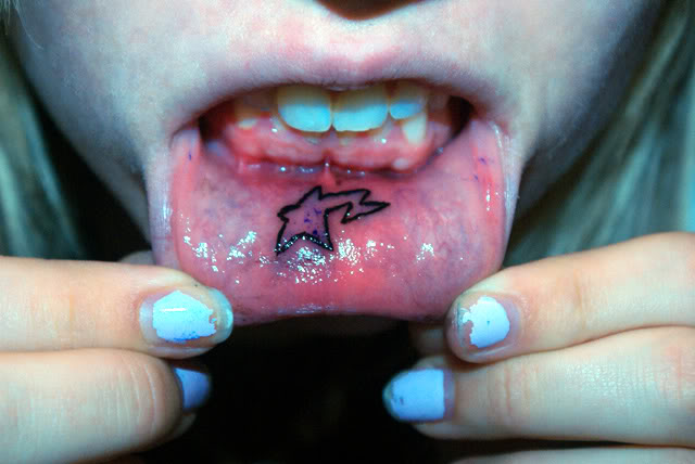 Star lip tattoo