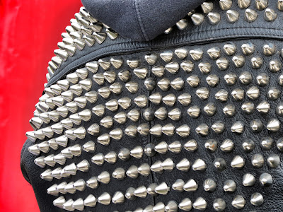 1234 Shoreditch Detail of studs on leather jacket