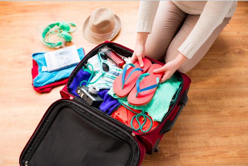 woman packing a suitcase