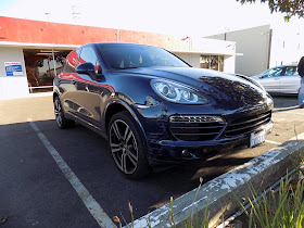 Porsche Cayenne hit by a concrete pillar before repairs at Almost Everything Auto Body.