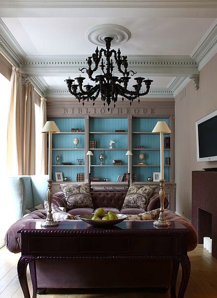 transitional library purple velvet sofa blue bookcases black chandelier
