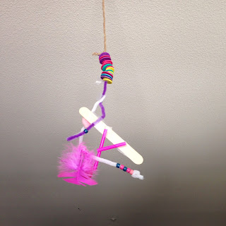 A mobile made of loose parts from the tinker box