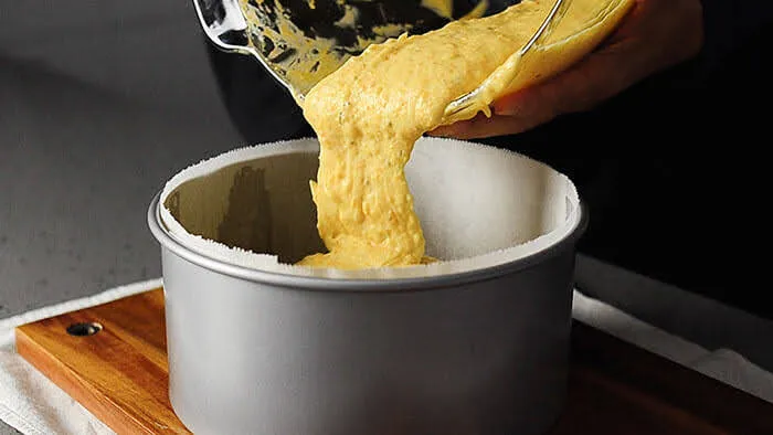 pour kumquat cake batter into baking pan