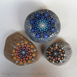 Mandala painted on stones using a dotting technique