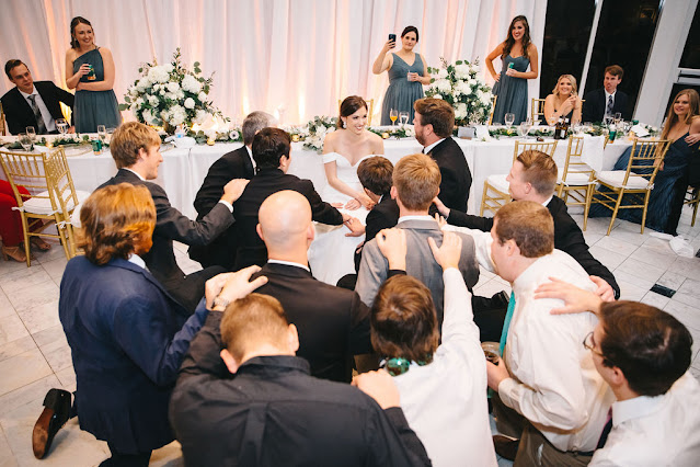 wedding guests dancing with bride and groom