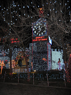 Houses covered in thousands and thousands of Christmas lights. Clock tower, etc