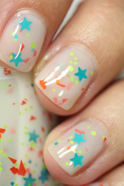 white jelly nail polish with star glitters