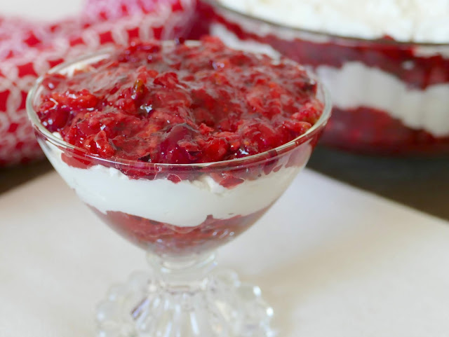 This delicious holiday salad is a tasty dessert for Thanksgiving or Christmas! In addition to the cranberries, this salad has apples, orange juice, pecans and any flavor red jello! We used raspberry and it was delicious! Homemade whipped cream and cream cheese is the perfect addition to the cranberries. This is always a hit at any gathering.