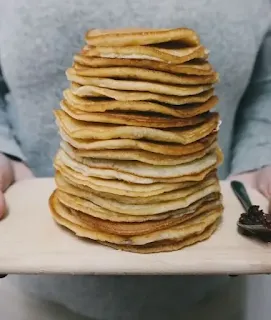 A pile of bread before a man to eat without sharing.Your sustenance is connected to the poor sustenance