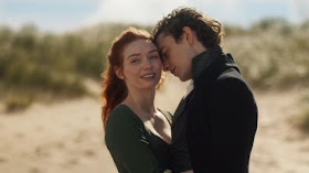 Demelza Poldark and Hugh Armitage cannoodle on the beach while Ross watches