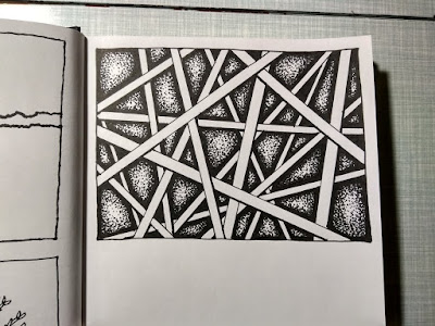 A pen and ink drawing of lines in a sketchbook.