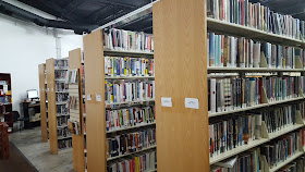 library book shelving in the temporary location at 25 Kenwood Circle
