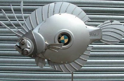 Brilliant hubcap sculptures Seen On www.coolpicturegallery.net