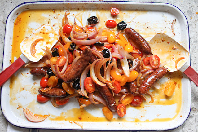 This Spicy Cod and Merguez Traybake is a lovely combination of mild and spicy, flaky and chewy, a tasty way to enjoy both cod and merguez in one dish, not to mention fresh tomatoes and salty olives.