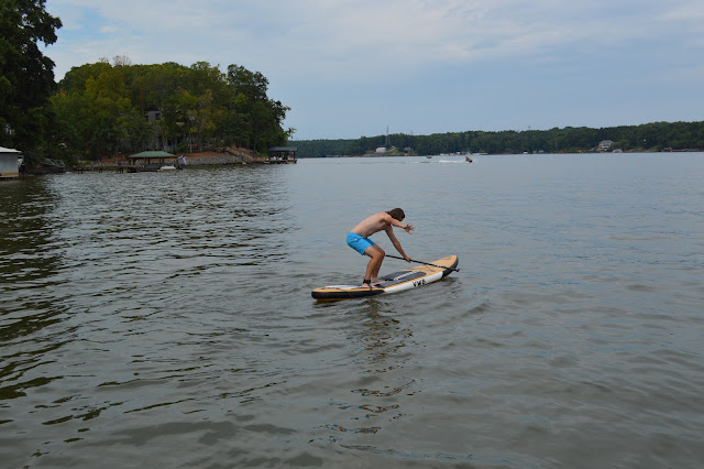 Andy standing on the paddleboard.