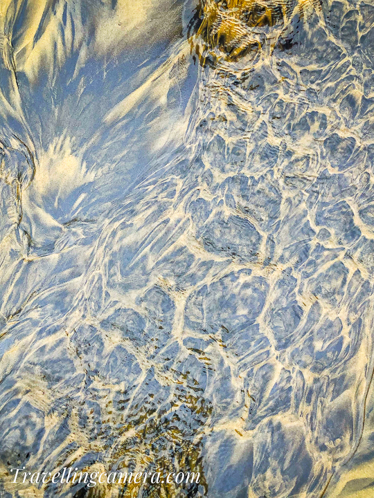 Above photograph shows a beautiful pattern of sand on the beach. This was created by a small water stream flowing from a backwater source to the beach. The water was constantly flowing through this path. I loved this pattern on the beach and thought of clicking a photograph.   Related Blogpost - Baga Beach - One of the most popular tourist places in Goa