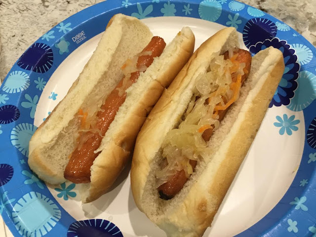 two roasted carrot hot dogs in hot dog buns