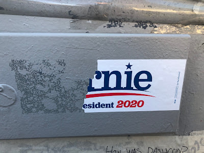 Bernie bumper sticker torn to read "rnie esident 2020"