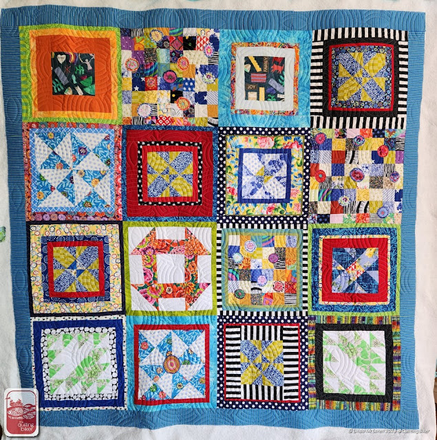 Bright embroidered applique quilt