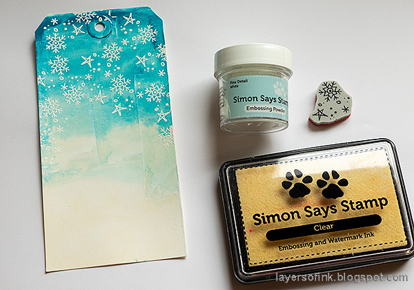 Layers of ink - Snowmen Mixed Media Tag Tutorial by Anna-Karin Evaldsson. Emboss the snowflakes.