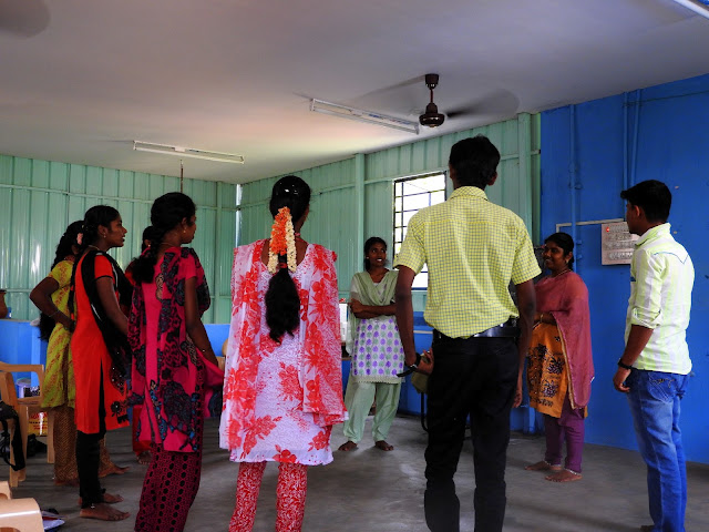 Manitham's mentors at their weekly training meeting