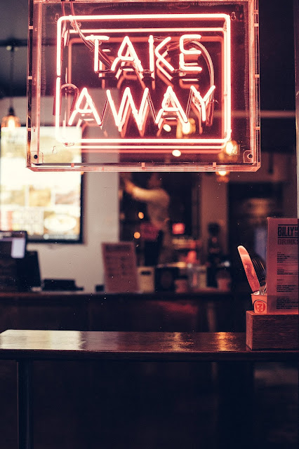 Takeaway neon sign. Photo by Clem Onojeghuo on Unsplash