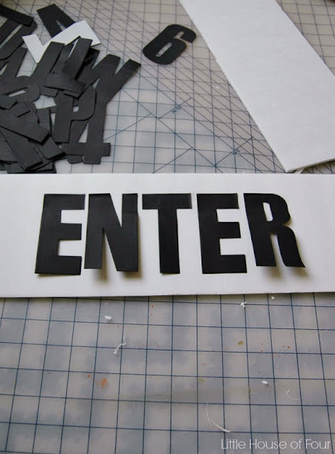 Arrange adhesive letters on foam board