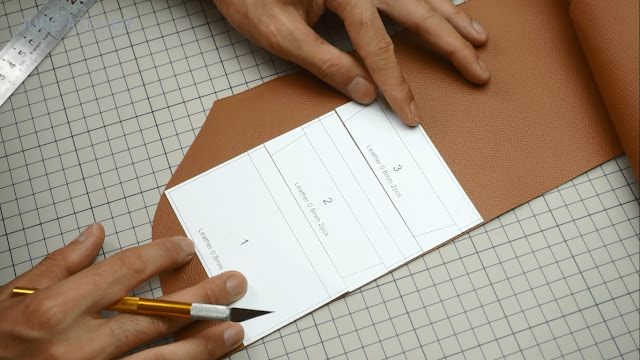 Cutting the leather according to the pattern