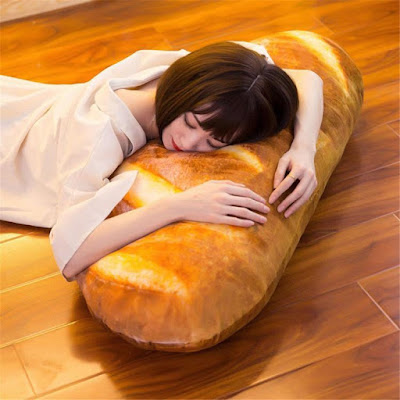 This Unique Pillow Shaped Like A Giant Loaf Of Bread, Perfect For Carbohydrate Lovers