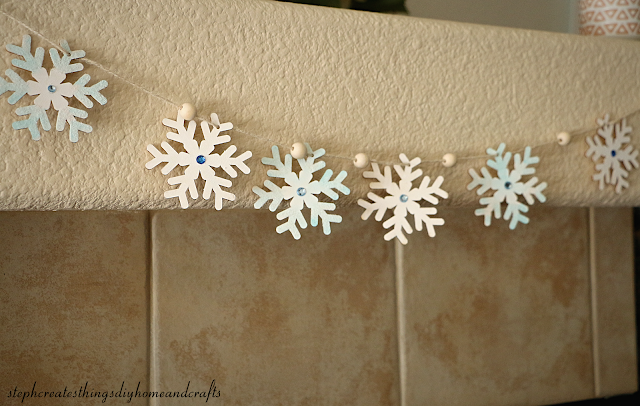 Wooden painted snowflake garland with beads hanging