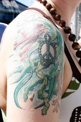 Peace Image On Upper Arm Tattoos