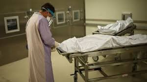 A medical examiner conducting an autopsy to determine the cause of death in a suspicious case.