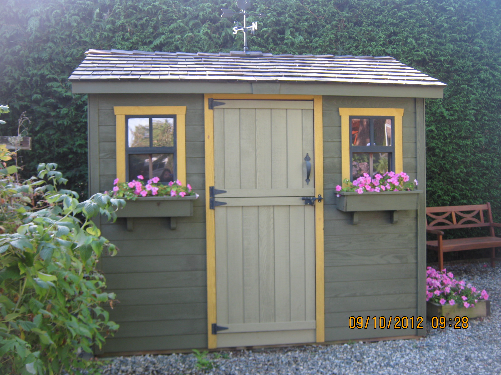 the garden shed painted to match the house. Love the window boxes, the ...