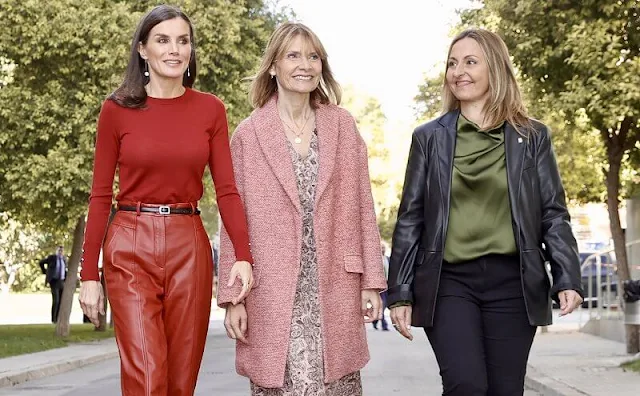 Queen Letizia wore a red frankie cuff detail wool sweater by Hugo Boss. Hugo Boss red leather trousers