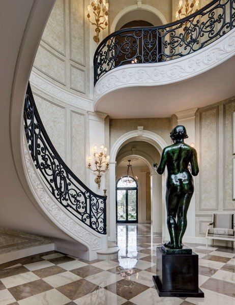 Wrought iron staircase and sculpture in Crispi Hicks Dallas estate