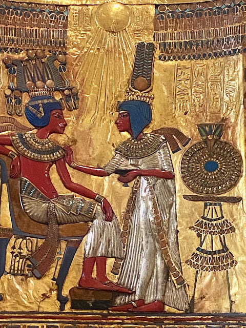 Tutankhamun's gold throne's backrest features a painting of the king and his queen, Ankhesenamun, in an unusually relaxed pose for Egyptian royal art. Changes to the names of the royals on the throne suggest that officials sought to erase the memory of Tutankhamun's controversial father, King Akhenaten, and his family members. REMLER, PAT