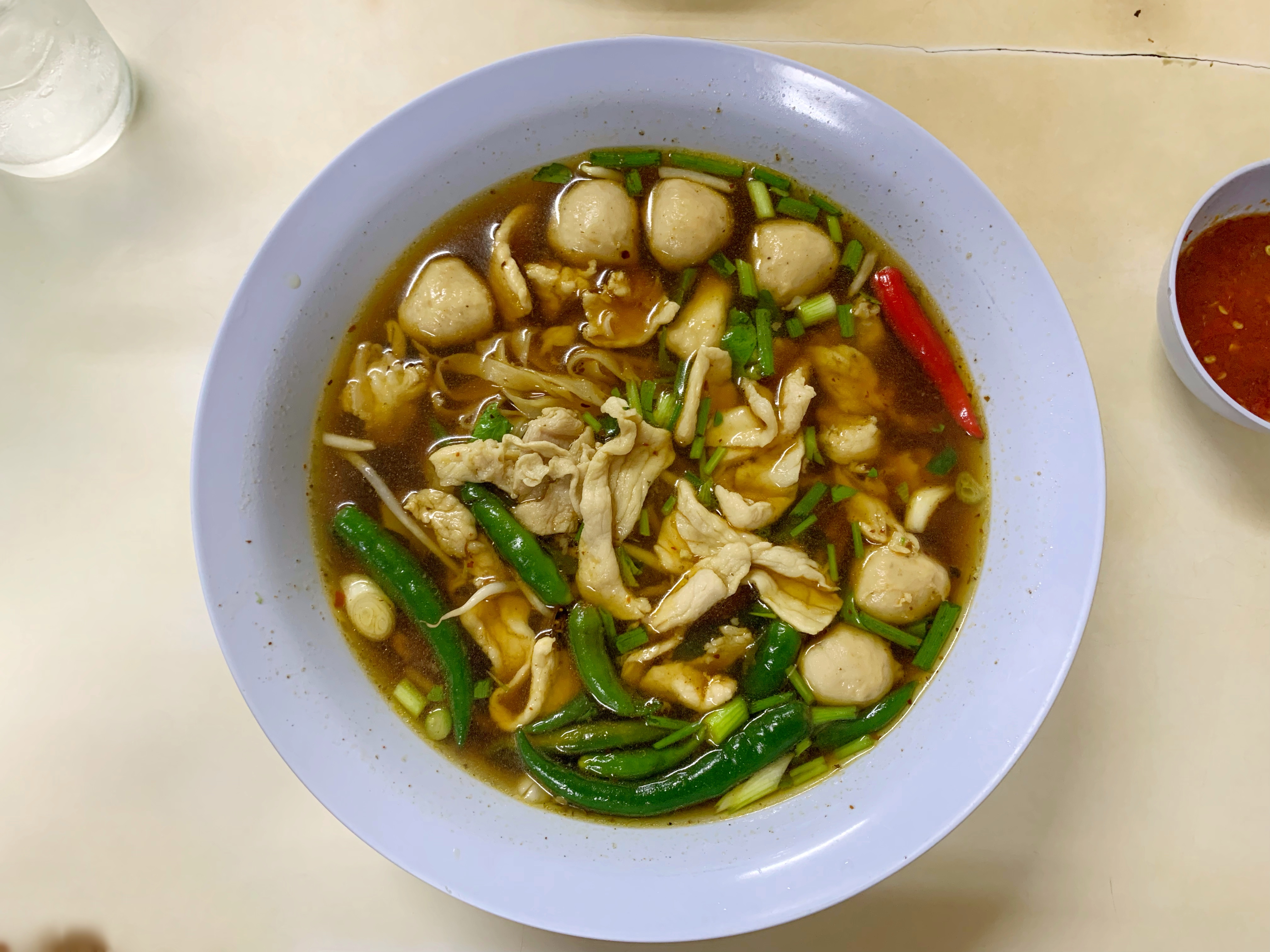 fresh tom yum noodles with pork in Bangkok, Thailand