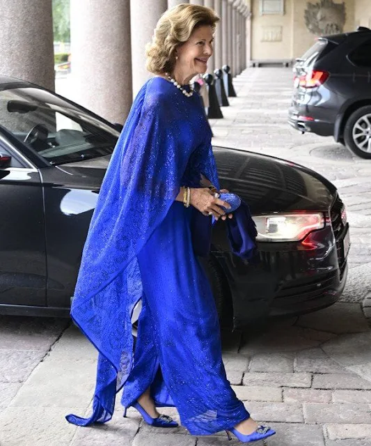 Queen Silvia wore a royal blue tulle gown. Manolo Blahnik Hangisi embellished royal blue satin pumps. Professor Wilfried Brutsaert