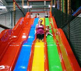 Mum and Eva on the slide at softplay