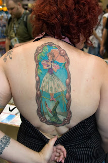 tattoo of one of the stretching room portraits on a woman's back