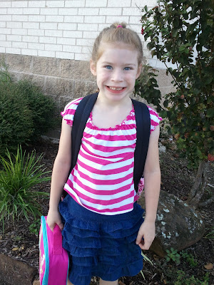 Posing in front of the school