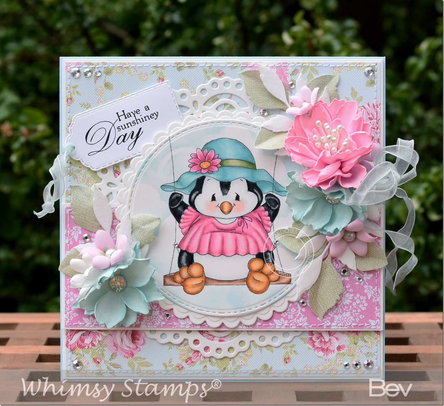 bev-rochester-whimsy-penguin-swings