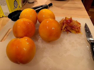 image of peeled peaches on cutting board